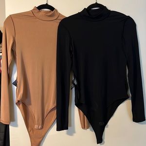 Black and beige turtle neck bodysuit